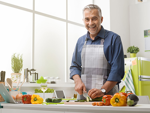 man preparing a healthy cancer preventing meal