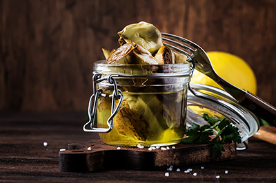 artichoke in a bottle of olive oil
