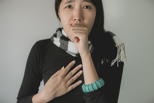 ear nose and throat remedies for Asian woman coughing