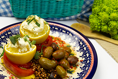 green olives and lemons on a plate