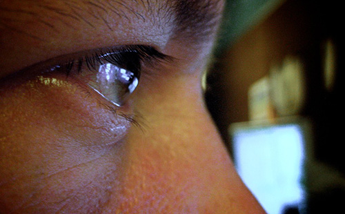 image of an closeup on an eye watching a screen
