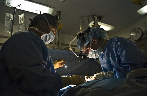 surgeons performing surgery
