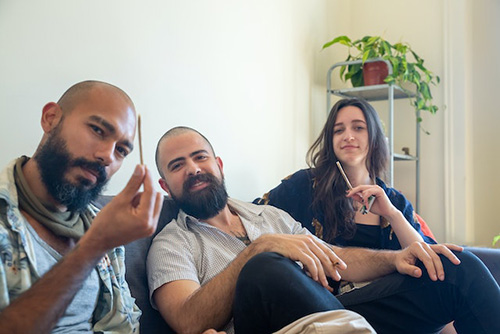 three people getting ready to smoke herbal remedies
