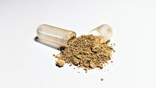 ashwagandha powder in a capsule