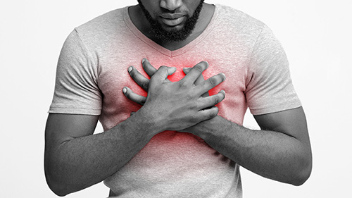 man holding his chest