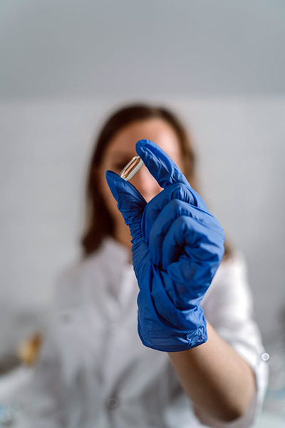 woman drug counselor holding cleansing herb capsule