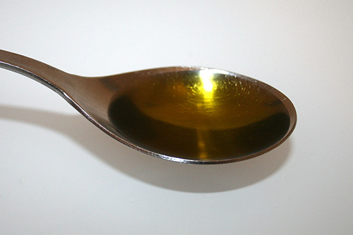spoon filled with cod liver oil