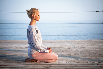 woman performing a relaxing yoga pose