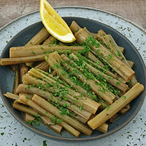 a plate of cooked cardoon stalks