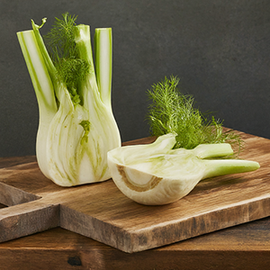 raw fennel sliced on a cutting board